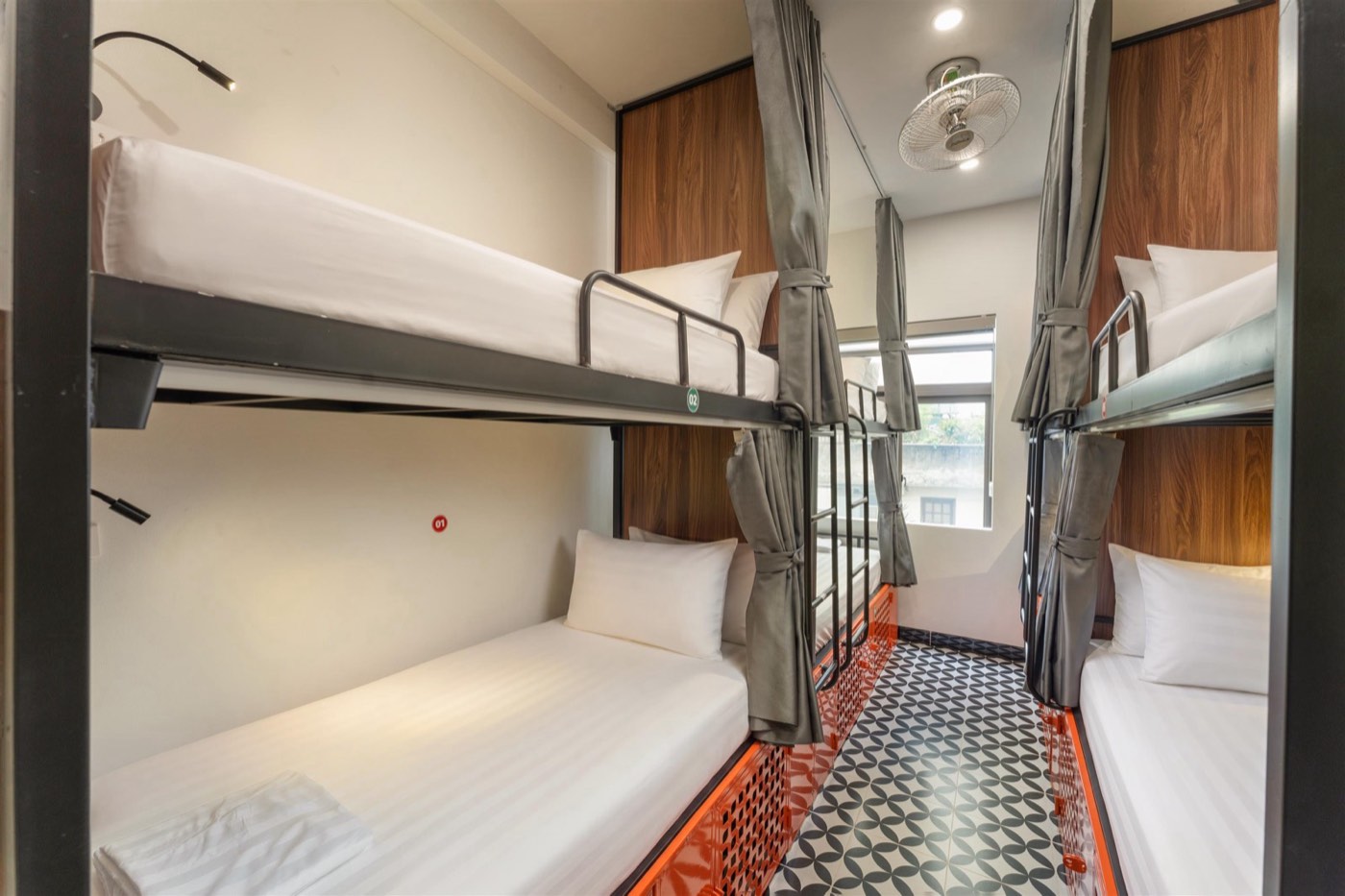 Dorm D501 with steel bunks and patterned tile floor