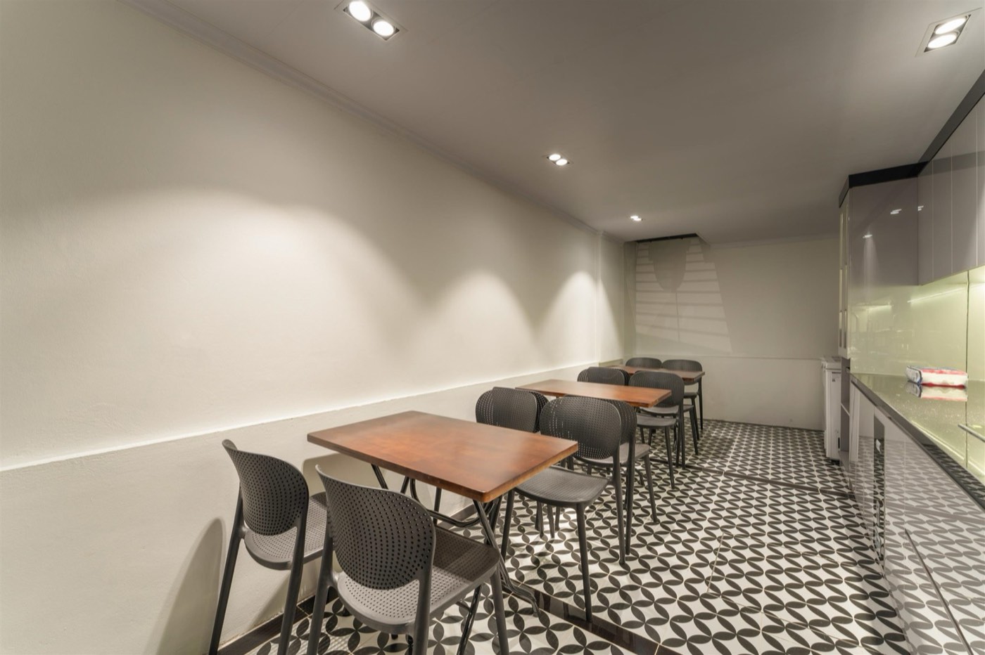 Tables and chairs beside the shared kitchen