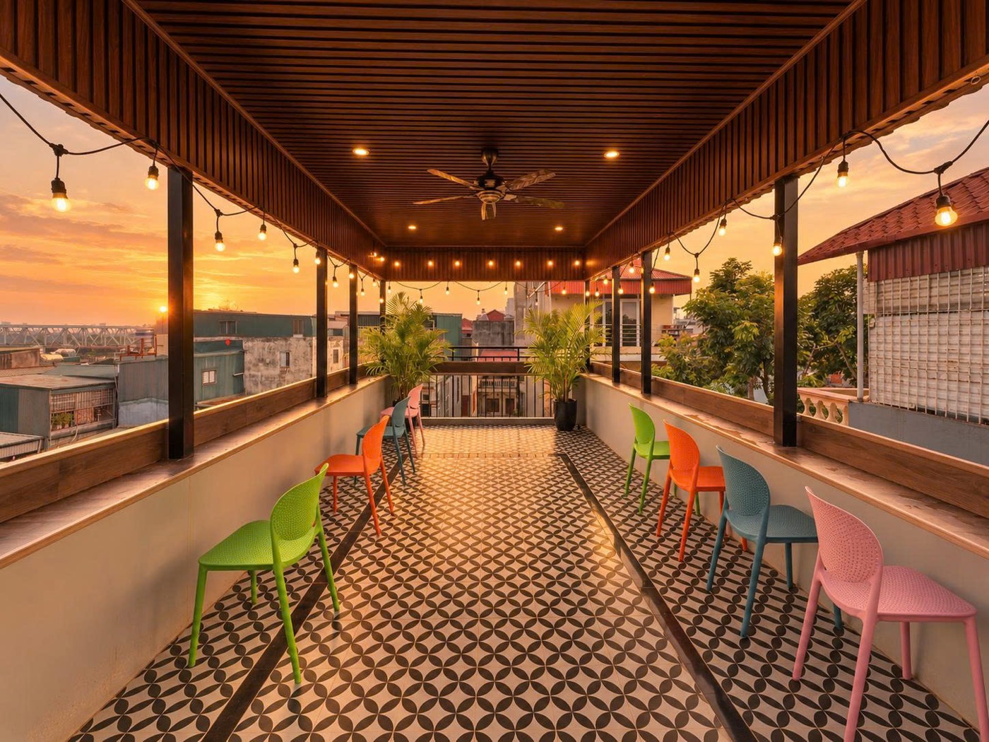 The length of the terrace at sunset, chairs along the rail